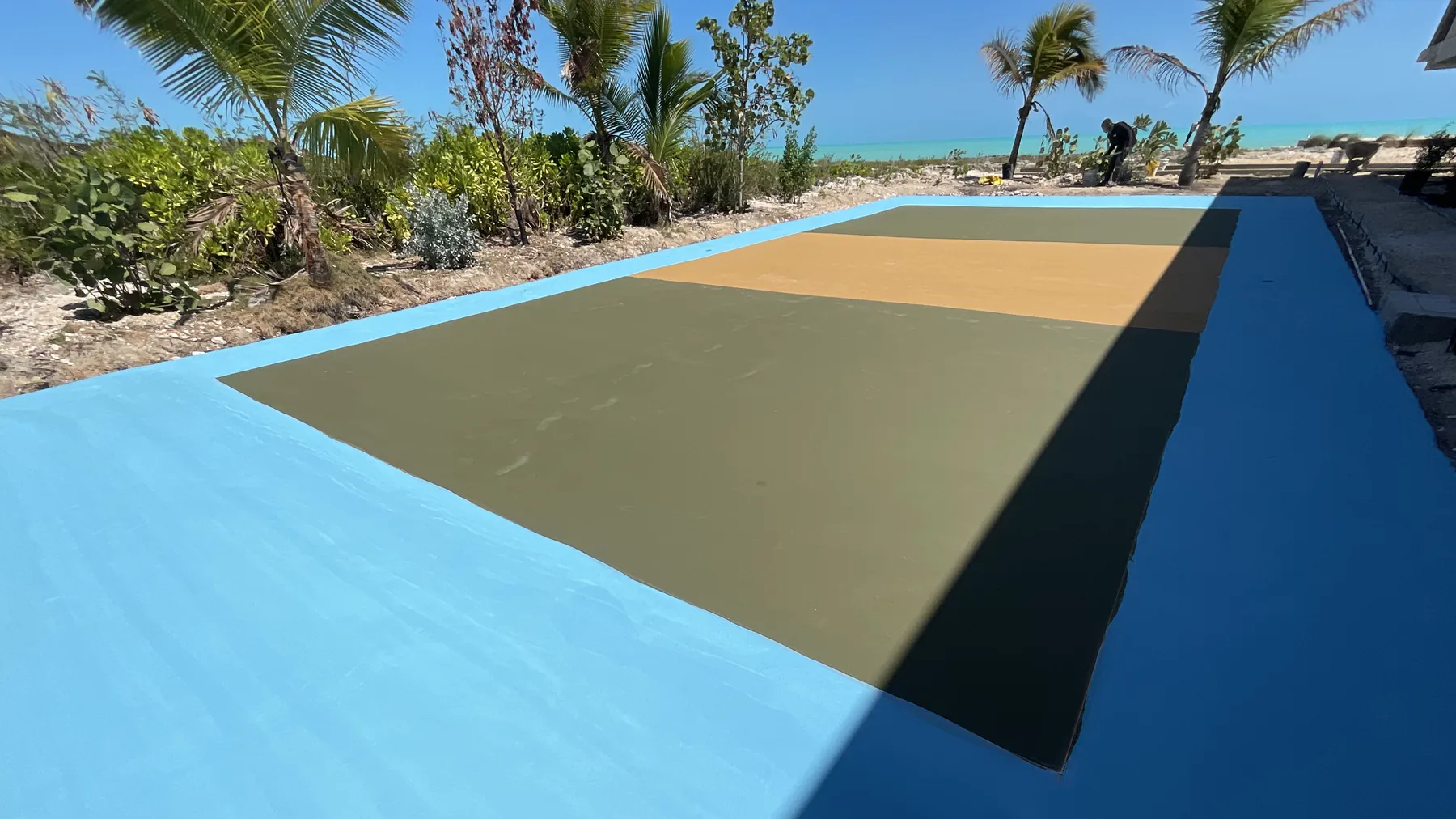 Completed court beside the shoreline in Providenciales